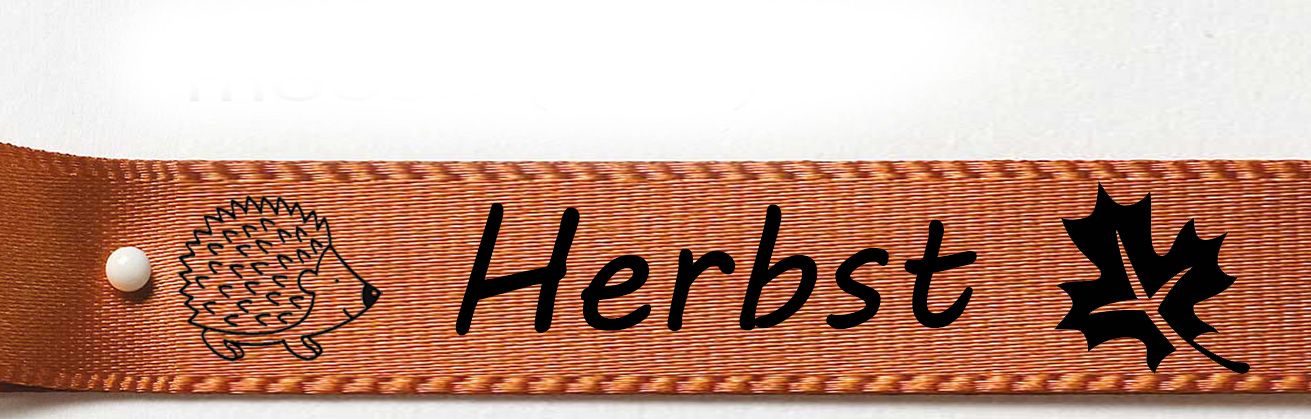 Herbstband-mocca-schwarz-igel-herbst-blaetter Herbstband aus Doppelsatinband mocca - Igel Herbst Blatt 15mm breit / 25m-Rolle